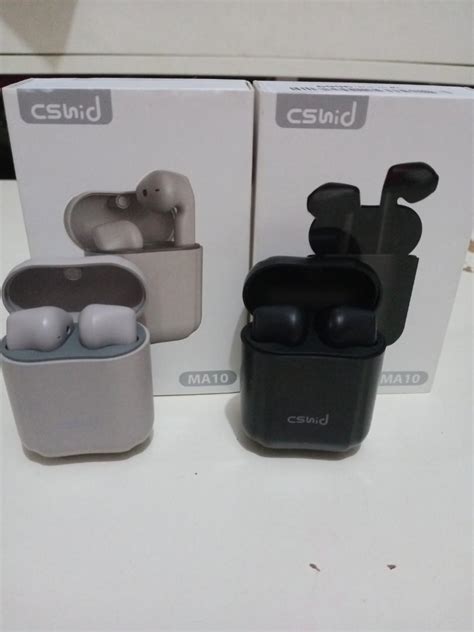 Remove the earbuds from the case, then press and hold the multi-function buttons on each earbud simultaneously until the LED lights flash red and blue to enter them into pairing mode. . Csnid ma10 earbuds manual